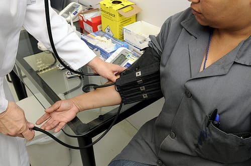 Doctor getting the blood pressure of a woman