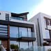 a modern house with transparent glass windows
