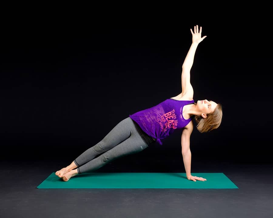 Woman side planking