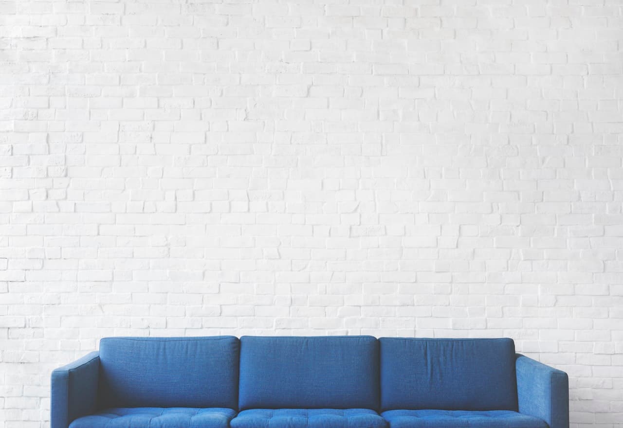 a blue couch with white background